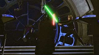 two people fighting with lightsabers, there is one green and one red lightsaber.