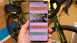 The Relive app held in hand