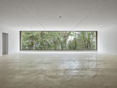 long vertical window looking out at the landscape at Fondation Maeght in France