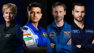 four people in flight suits pose for a portrait