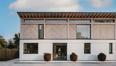 Hampshire home exterior with white plaster and timber cladding