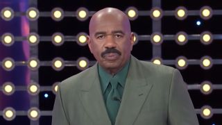 Steve Harvey pretending to be upset on Family Feud