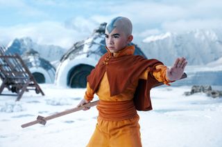 Avatar Aang (Gordon Cormier) stands with his staff in the Southern Water Tribe in Netflix&#039;s live-action take on Avatar The Last Airbender.