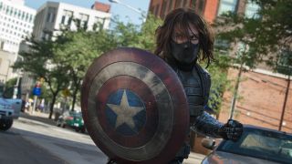 Masked Bucky Barnes as Winter Soldier holding Captain America&#039;s shield