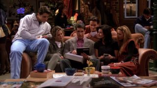 The Friends cast sitting at Central Perk