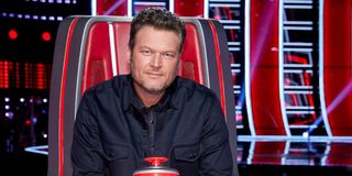 The Voice Blake Shelton sitting in chair. Headshot