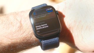 Close-up of an Apple Watch 10 on a user&#039;s wrist with the screen showing that the sleep apnea safety feature is switched on