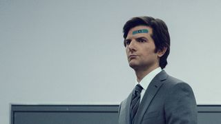 Adam Scott as Mark Scout in Severance, with a blue bandaid on his forehead, looking away