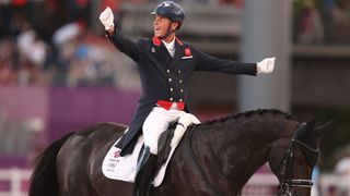 Carl Hester of Team Great Britain riding En Vogue reacts in the Dressage Team Grand Prix Special Team Final on day four of the Tokyo 2020 Olympic Games at Equestrian Park on July 27, 2021 in Tokyo, Japan