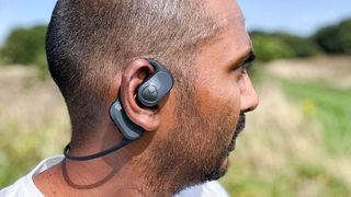 Soundpeats Runfree worn by reviewer outside