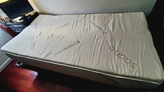 Saatva Foam Mattress Topper in full on top of bed