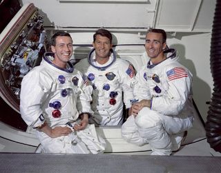 The crew of the first manned Apollo space mission inside the White Room. From left to right, are Donn Eisele, Walter Schirra, and Walter Cunningham.