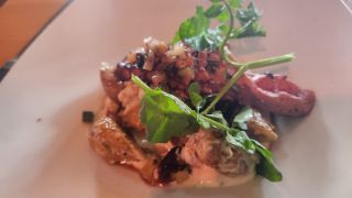 charred octopus appetizer at Mythos restaurant