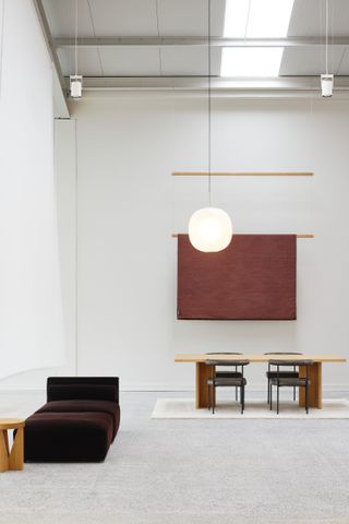 view of showroom in auckland, chairs, wall hanging and lighting