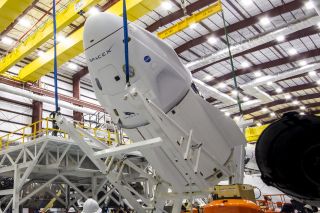 The Crew Dragon "Endeavour" is lifted and mated to its Falcon 9 rocket at NASA Kennedy Space Center’s Launch Complex 39A , on April 13, 2021. 