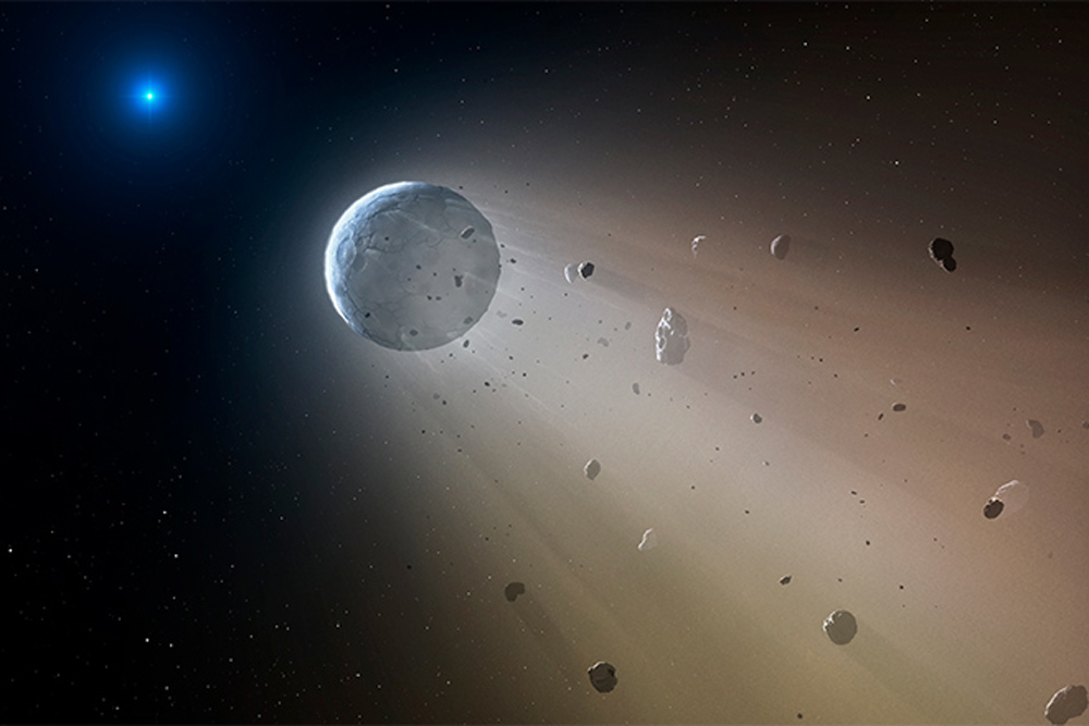 Artist’s impression of WD 1145+017 (white dwarf star, at left) and a planet shedding