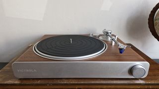 Victrola Stream Sapphire turntable on a wooden table