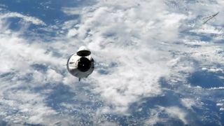 A view of SpaceX's Crew-2 Dragon spacecraft Endeavour with the Earth in the background as it flew around the International Space Station following undocking on Nov. 8, 2021.