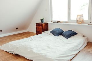 A mattress placed directly on the floor