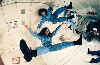 Teacher in space Christa McAuliffe (top), backup crew member Barbara Morgan (bottom) and payload specialist Greg Jarvis (back right) training in a KC-135 “vomit comet” in the 1980s.