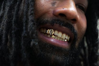 Student Andre Baptiste proudly showing off his new gold grillz