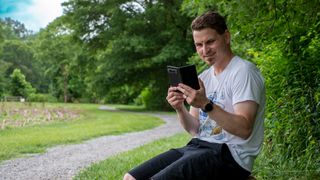 Using a Google Pixel Fold on a park bench while it's unfolded