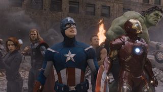 From left to right: Black Widow holding up a gun, Thor holding up his hammer, Captain America holding his shield in his right hand, Hawkeye looking up, Iron Man looking up and Hulk looking up in Avengers.