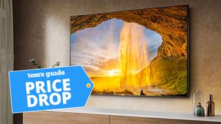 Hisense U7H QLED TV on wall with deal tag 