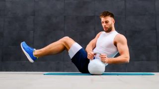 Man doing kettlebell ab workout