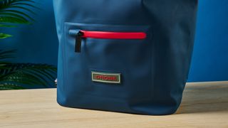 A photo of the D-Robe Roll-Top backpack front pocket