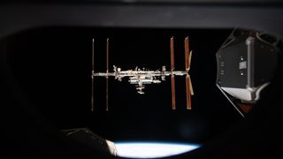 international space station seen through a spacecraft window