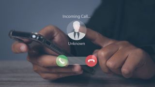 Phone scam showing an unknown caller on a phone screen