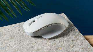 A white wireless Microsoft Surface Precision mouse