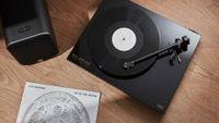 Goldring GR3 turntable in black with speaker and vinyl record