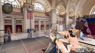 A Call of Duty: Black Ops 6 multiplayer screenshot showing a shootout in a wide open hall.