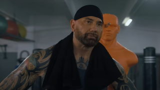 JJ (Dave Bautista) looks tired after a workout in My Spy The Eternal City