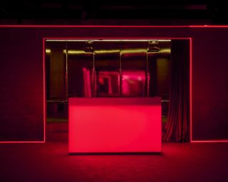 Silencio New York boasts eclectic red and golden interiors drip in neon lights