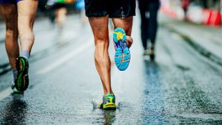 A phot of a man&#039;s feet running a 5K 