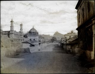 Trichinopoly. Street view, the rock in the distance