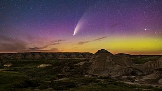 a bright white streak in the night sky above the desert