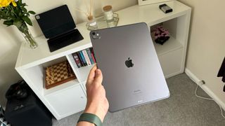 Apple iPad Pro 13-inch M4 tablet closed and held in hand