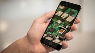 Stock images of multiple Raspberry Pi being controlled from a smartphone