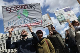 Marchers show their support for science and call attention to climate change in Berlin, Germany.