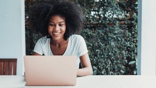 A woman using a VPN on a laptop