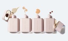 Four flask-shaped bottles in beige with embedded logo on each Westman Atelier. 