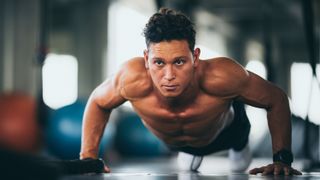 s photo of a man performing a plank