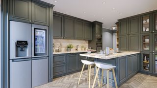A green kitchen with a range of appliances 