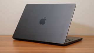 Apple MacBook Pro 14-inch M4 2024 on a wooden desk