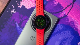 Pixel Watch 2 sitting atop OnePlus Open camera module