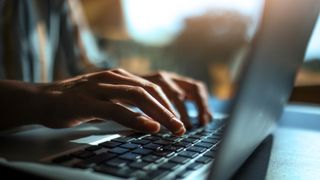 Close up of a hands on a laptop keyboard